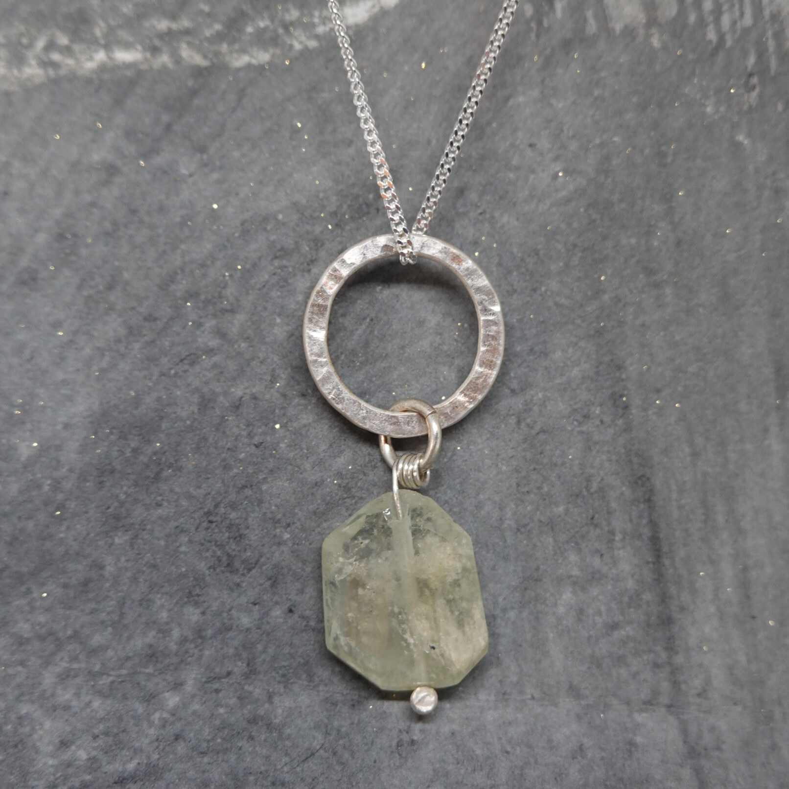 Aquamarine drop pendant on circle on circle