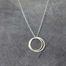 Circle necklace in silver and gold